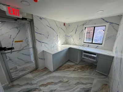 an unfinished room with a counter and a window at Essence Express Elizabeth EWR Airport in Elizabeth