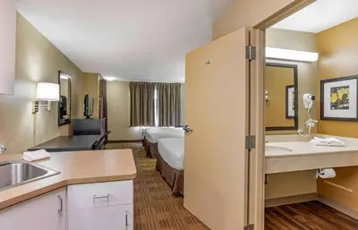 a hotel room with a bed and a bathroom at Extended Stay America Suites - Philadelphia - Horsham - Welsh Rd in Horsham