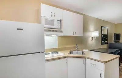 a kitchen with a white refrigerator and a sink at Extended Stay America Suites - Philadelphia - Horsham - Welsh Rd in Horsham