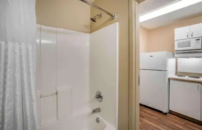 a bathroom with a shower and a white refrigerator at Extended Stay America Suites - Philadelphia - Horsham - Welsh Rd in Horsham