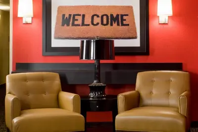 two chairs and a lamp in a waiting room at Extended Stay America Suites - Philadelphia - Horsham - Welsh Rd in Horsham
