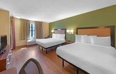 a hotel room with two beds and a television at Extended Stay America Suites - Philadelphia - Horsham - Welsh Rd in Horsham