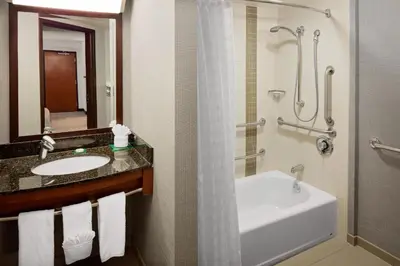 a bathroom with a sink and a tub and a shower at Hyatt Place Princeton in Princeton
