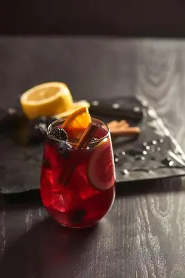 a red drink with orange slices on a table at Hyatt Place Princeton in Princeton