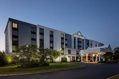 a rendering of a hotel building at dusk at Hyatt Place Princeton in Princeton