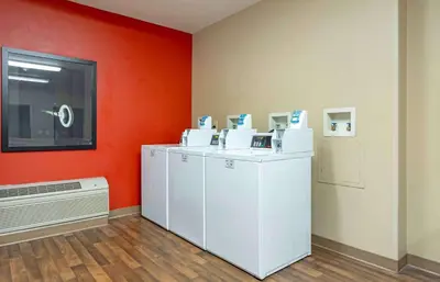 a room with two washers and a dryer at Extended Stay America Suites - Meadowlands - Rutherford in Rutherford