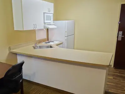 a kitchen with a sink and a white refrigerator at Extended Stay America Suites - Meadowlands - Rutherford in Rutherford