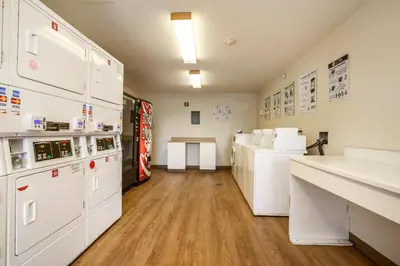a laboratory with white appliances in a room at HomeTowne Studios by Red Roof Philadelphia - Maple Shade, NJ in Maple Shade