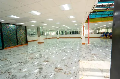 a large hallway with a marble floor in a building at Philly Inn & Suites in Philadelphia