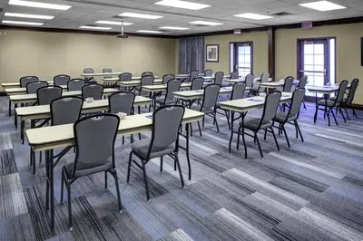 a classroom with tables and chairs in a room at Hyatt House Parsippany Whippany in Whippany