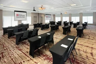 a conference room with black tables and chairs at Hilton Garden Inn Valley Forge/Oaks in Oaks