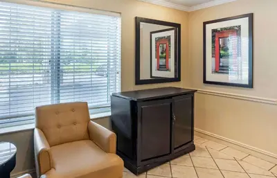a living room with a tv and a chair at Extended Stay America Suites - Philadelphia - Horsham - Dresher Rd in Horsham