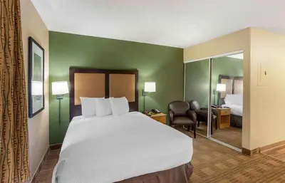 a hotel room with a large bed and a bedroom at Extended Stay America Suites - Philadelphia - Horsham - Dresher Rd in Horsham