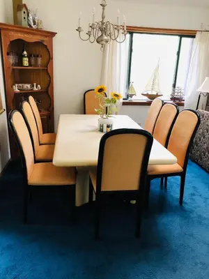 a dining room with a table and chairs and a window at My Little Flagship Cabin in East Stroudsburg