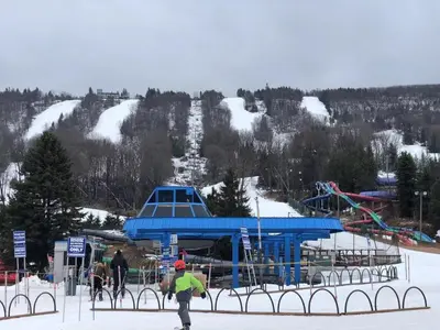 a group of people on skis at a ski resort at My Little Flagship Cabin in East Stroudsburg