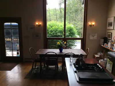 a kitchen with a table and chairs and a window at Hawk Mountain Bed & Breakfast in Kempton
