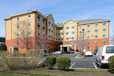 a parking lot in front of a building at Extended Stay America Suites - Secaucus - Meadowlands in Secaucus