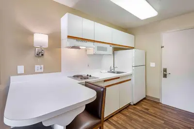 a kitchen with white cabinets and a white refrigerator at Extended Stay America Suites - Philadelphia - King of Prussia in King of Prussia