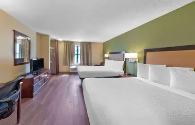 a hotel room with two beds and a flat screen tv at Extended Stay America Suites - Philadelphia - King of Prussia in King of Prussia
