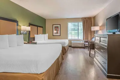 a hotel room with two beds and a flat screen tv at Extended Stay America Suites - Philadelphia - King of Prussia in King of Prussia