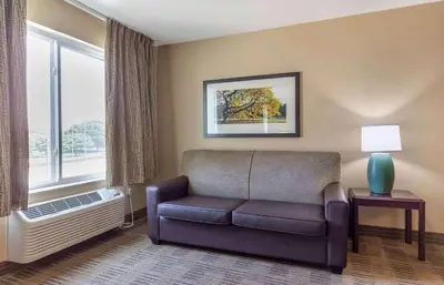 a living room with a couch and a window at Extended Stay America Suites - Newark - Christiana - Wilmington in Rutherford