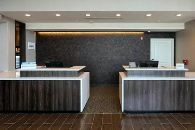 a lobby with reception desks in a hotel at Residence Inn by Marriott Harrisburg North in Harrisburg