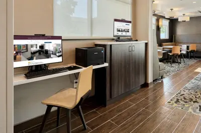 a waiting room with a computer and a desk at Residence Inn by Marriott Harrisburg North in Harrisburg
