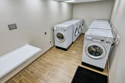 a laundry room with a washer and dryer in it at Residence Inn by Marriott Harrisburg North in Harrisburg