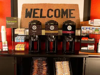 a store with a welcome sign on a counter at Extended Stay America Suites - Philadelphia - Airport - Tinicum Blvd in Philadelphia