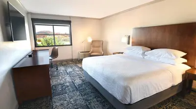 a hotel room with a large bed and a window at Four Points by Sheraton York in York