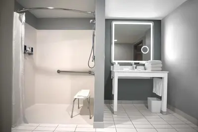 a bathroom with a sink and a mirror at Four Points by Sheraton York in York