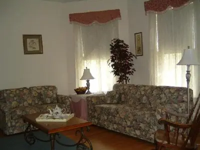 a living room with two couches and a table at Wayne on Main in Honesdale