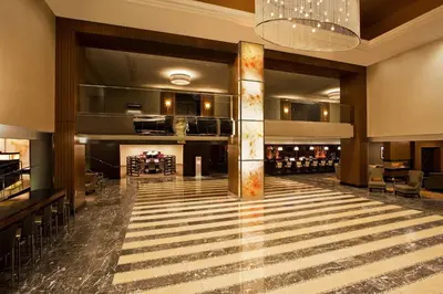 a large lobby with a bar and a wine cellar at Sheraton Valley Forge King of Prussia in King of Prussia