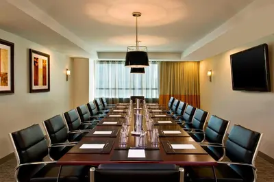 a large conference room with a long table and chairs at Sheraton Valley Forge King of Prussia in King of Prussia