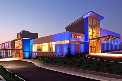a large building with blue lights in front of it at Sheraton Valley Forge King of Prussia in King of Prussia