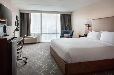 a hotel room with a large bed and a television at Four Points Philadelphia Northeast in Philadelphia