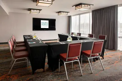 a conference room with a long table and chairs at Four Points Philadelphia Northeast in Philadelphia