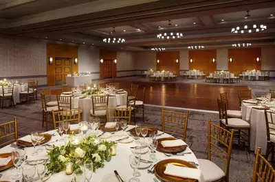 a banquet hall with white tables and chairs at Hyatt Regency Morristown in Morristown