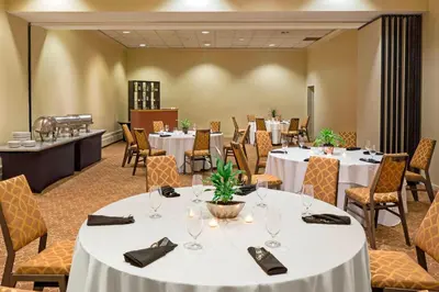 a conference room with tables and chairs at Sheraton Harrisburg Hershey Hotel in Harrisburg