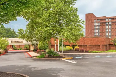 a parking lot in front of a brick building at Sheraton Harrisburg Hershey Hotel in Harrisburg