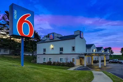 a large house with a sign in front of it at Motel 6-Gordonville, PA - Lancaster PA in Gordonville