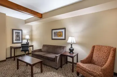 a living room with a couch and a chair at Best Western Plus Intercourse Village Inn in Intercourse