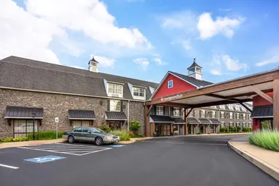 a car parked in a parking lot in front of a building at Best Western Plus Intercourse Village Inn in Intercourse