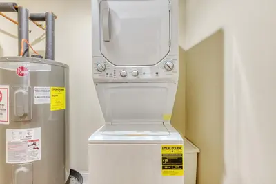 a water heater next to a machine in a room at The Cherry Suites - Chinatown in Philadelphia