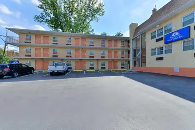 an empty parking lot in front of a building at Media Inn & Suites in Media