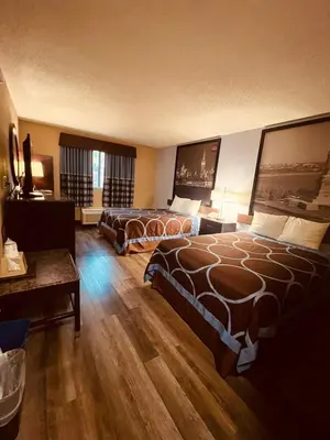 a hotel room with two beds and a table at FairBridge Inn Express Nyack in Nyack