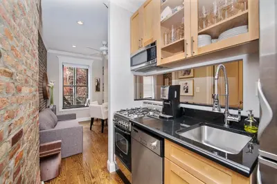 a kitchen with a sink and a stove at APARTMENT NOLITA in New York