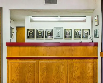 a waiting room with wooden cabinets and posters on the wall at Econo Lodge Mifflintown in Mifflintown