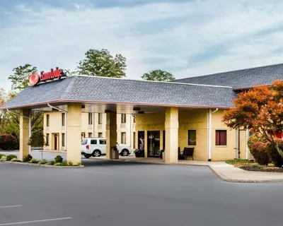 a hotel with a parking lot in front of it at Econo Lodge Mifflintown in Mifflintown