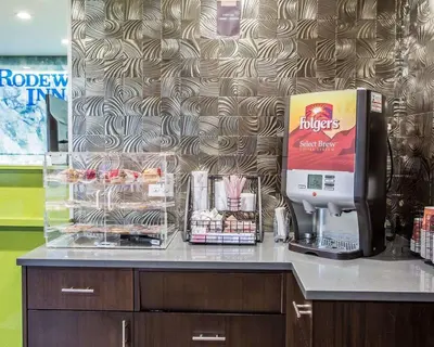 a coffee machine on a counter in a store at Rodeway Inn Belleville in Belleville